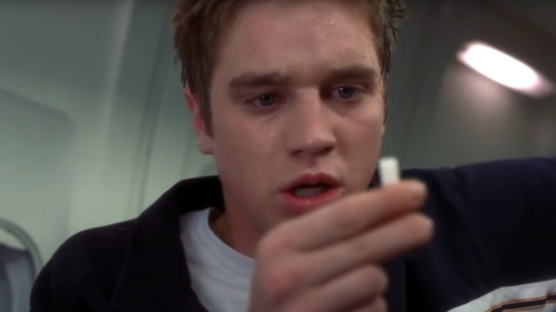 Alex stares in disbelief 