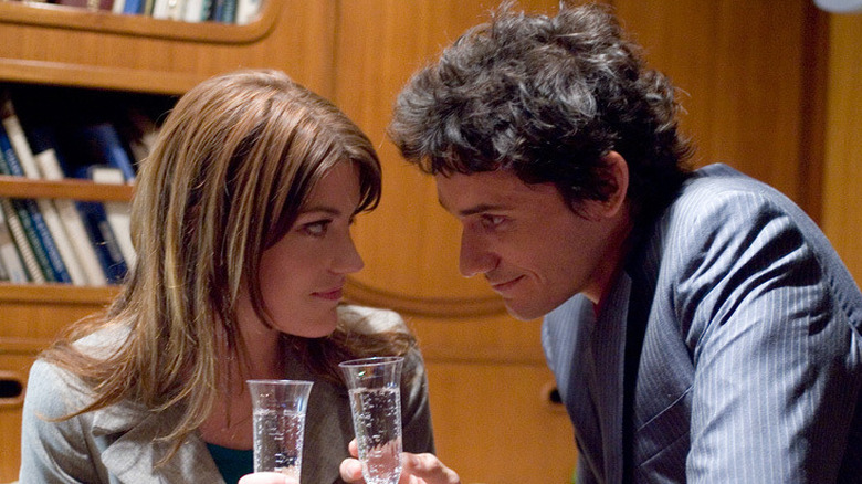 Deb and Rudy share a toast in "Dexter" (2006)