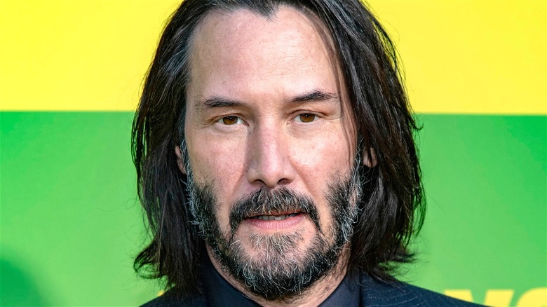 Keanu Reeves long hair beard headshot