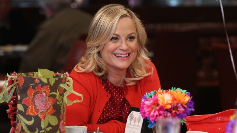 Leslie Knope smiling on Galentine's Day