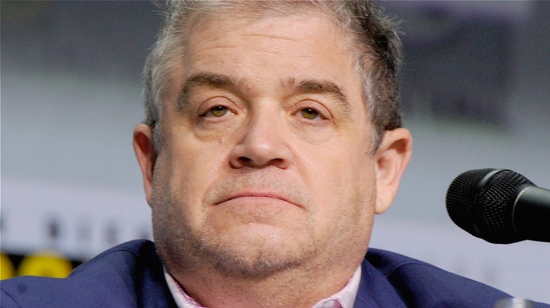 Patton Oswalt near a microphone