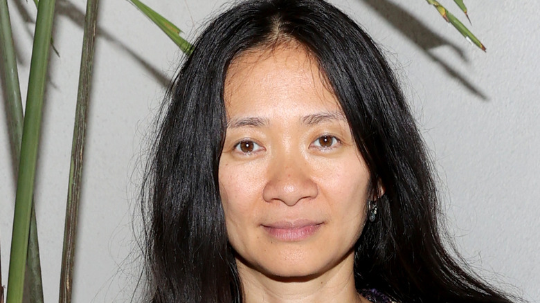 Chloe Zhao looking into camera