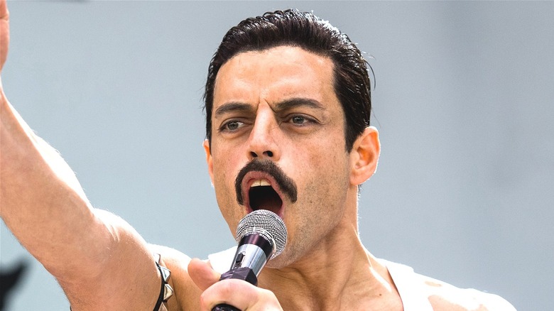 Rami Malek as Freddie Mercury singing