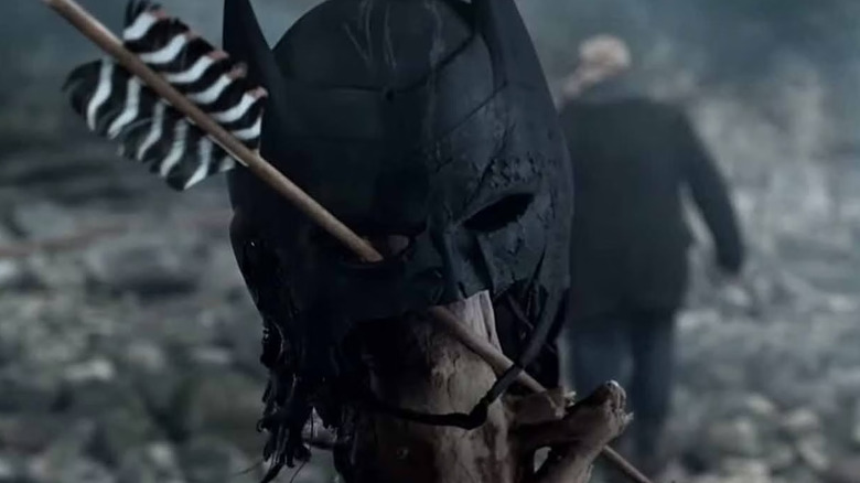 Batman cowl with arrow through it