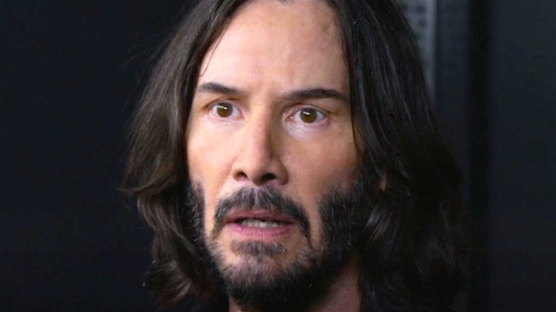 Keanu Reeves as Neo looking shocked 