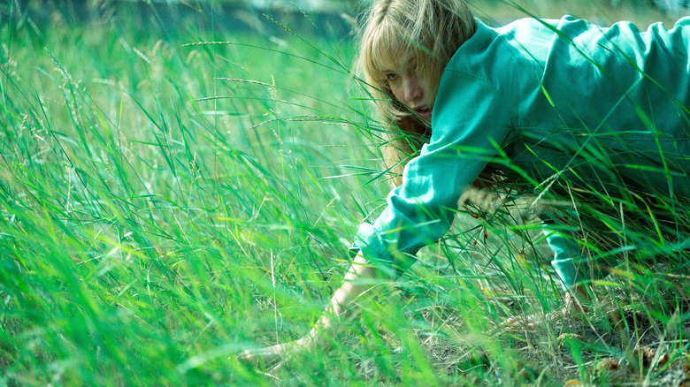 Grace crawling through grass in 