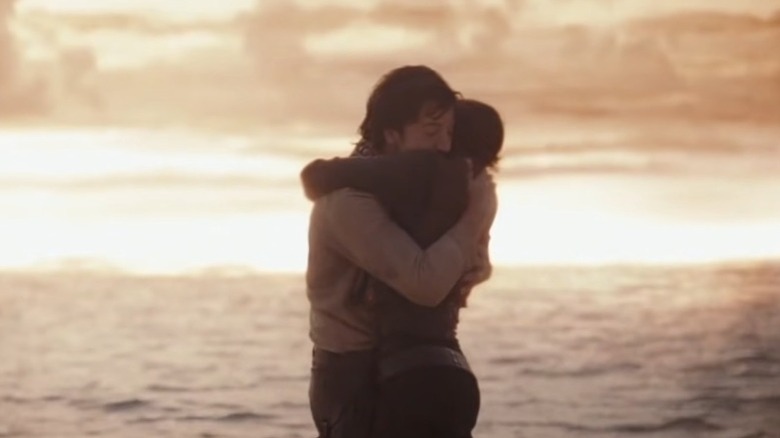 Cassian Andor and Jyn Erso embracing