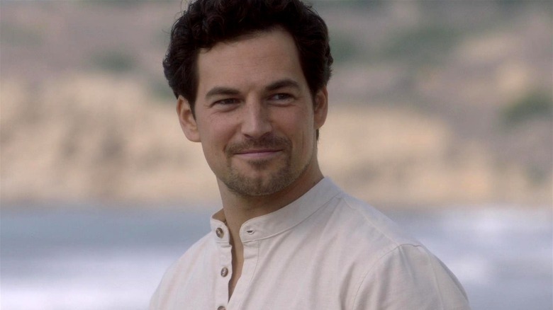 Andrew DeLuca smiling on the beach in Grey's Anatomy