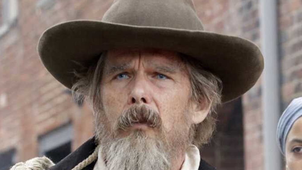 Ethan Hawke as John Brown in brown hat on Good Lord Bird