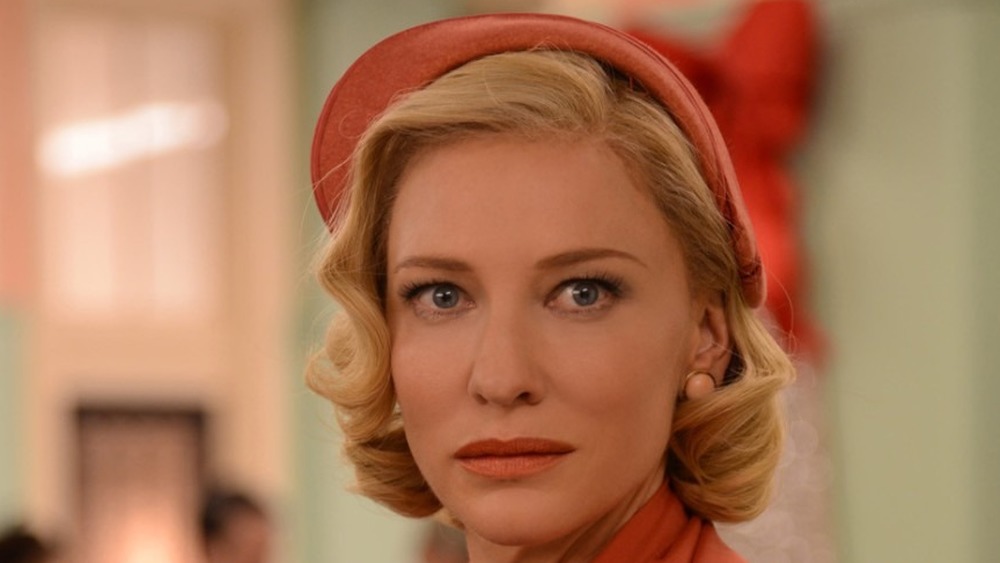 Cate Blanchett as Carol wearing salmon colored hat