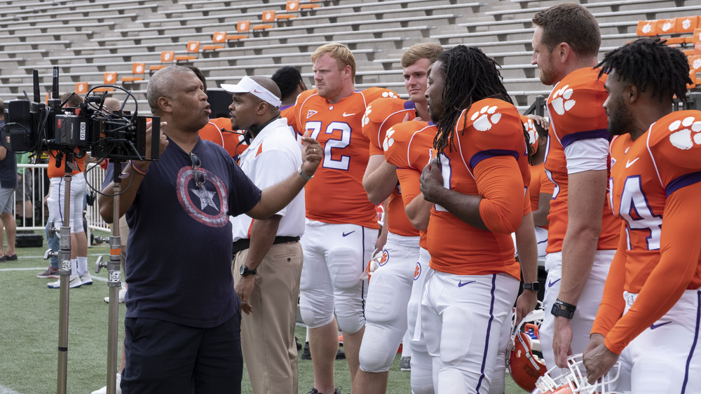 Director Reginald Hudlin behind the scenes with the cast of SAFETY, exclusively on Disney+