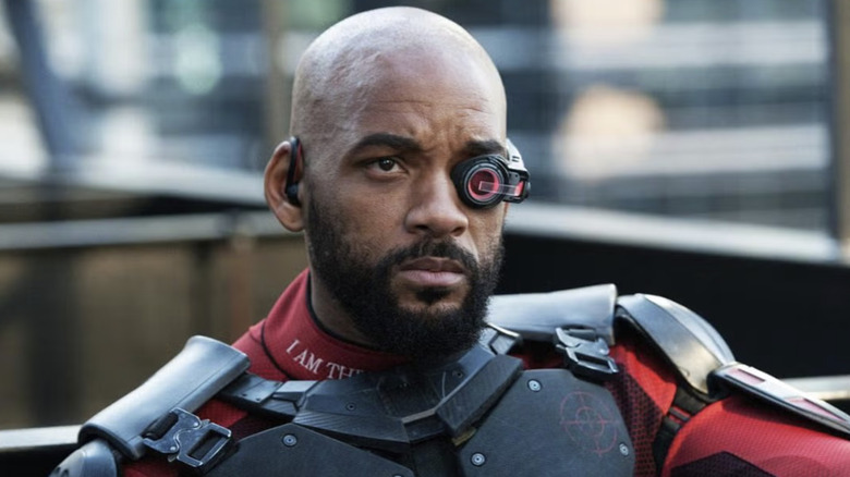 Deadshot seated and looking concerned in 