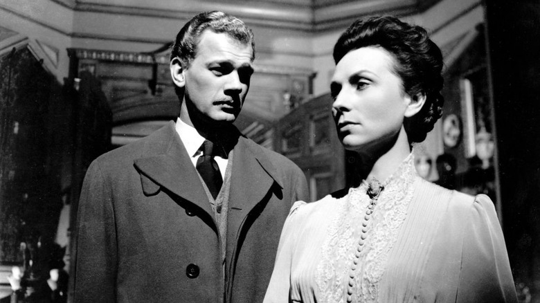 Eugene and Fanny standing sternly in "The Magnificent Ambersons" (1942)