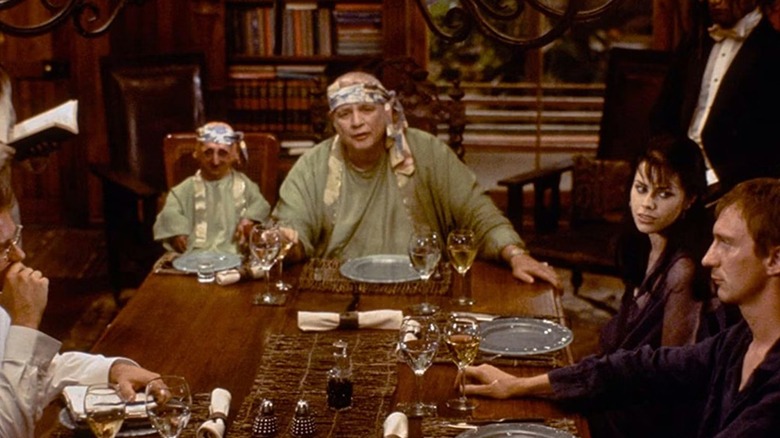 Dr. Moreau hosts an awkward dinner in "The Island of Dr. Moreau" (1996)