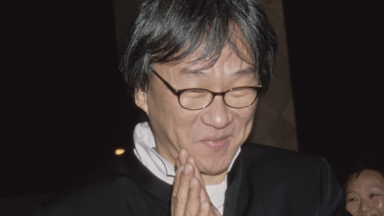 Edward Yang holding hands together