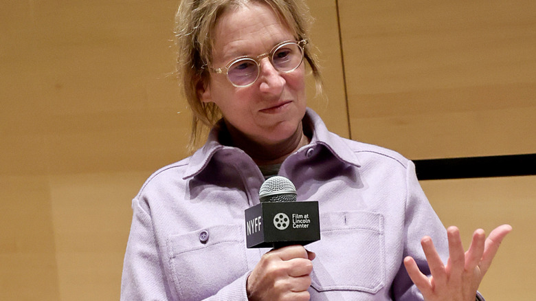 Kelly Reichardt holding microphone