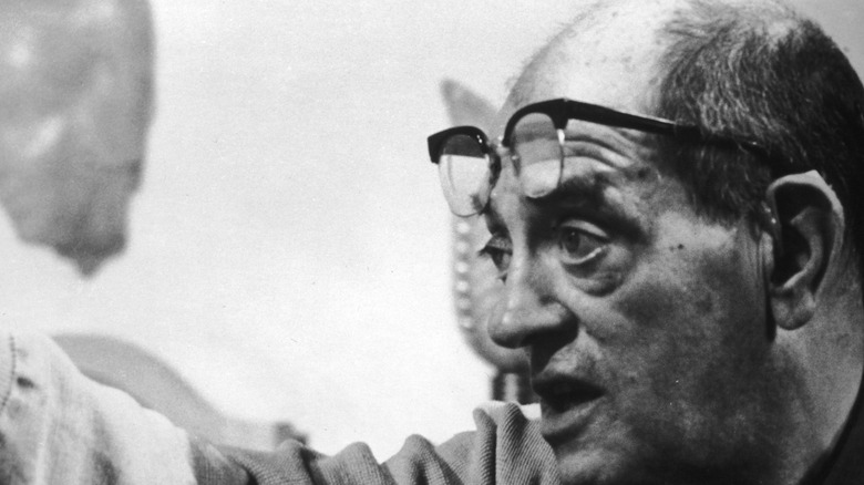 Luis Bunuel with glasses on forehead