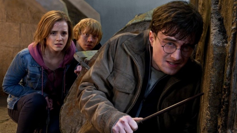Emma Watson as Hermione Granger, Rupert Grint as Ron Weasley, and Daniel Radcliffe as Harry Potter