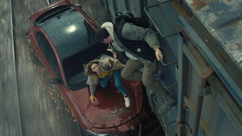 Daniel getting Margaret onto a train in Disclosure Day