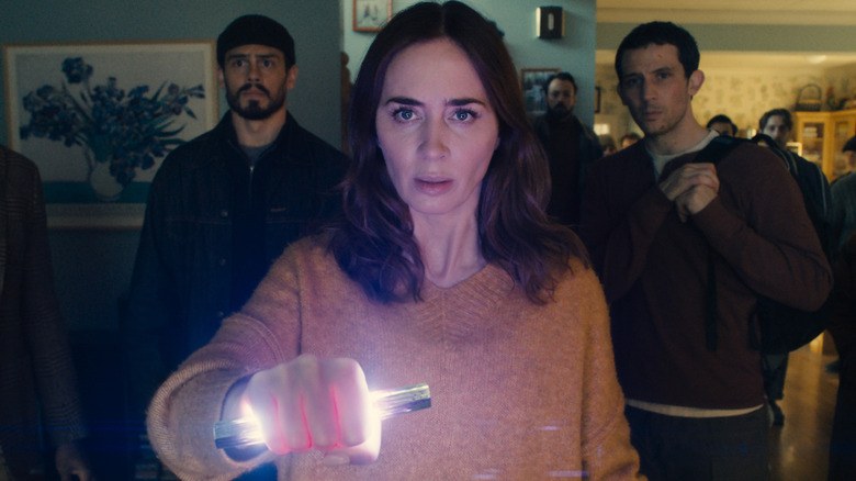 Margaret wields an alien device with Santiago and Daniel behind her in 