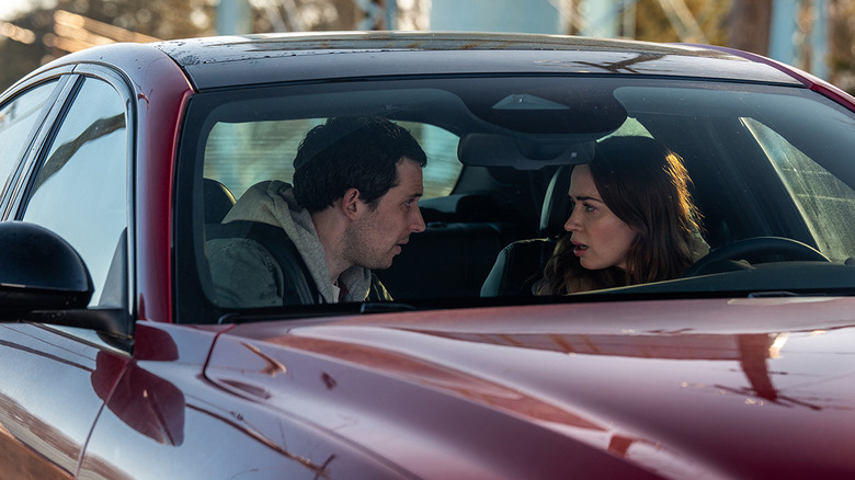 Daniel and Margaret talking in a red car in "Disclosure Day" (2026)