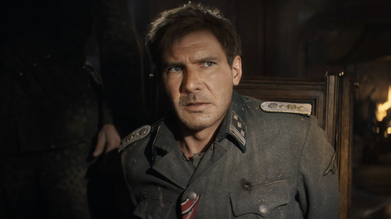 Young Indiana Jones sitting in chair