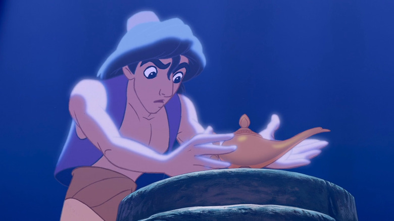 Aladdin picking up lamp