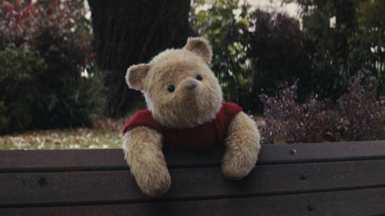 Winnie-the-Pooh smiling at Christopher Robin in Christopher Robin