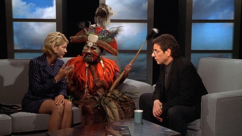 Dr. Krippendorf going on television in disguise in Krippendorf's Tribe (1998)