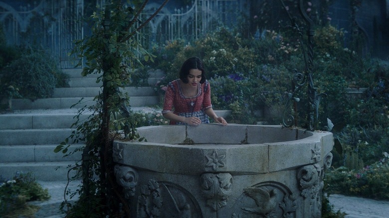 Snow White talking into a well