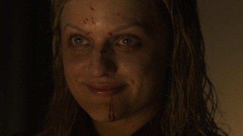 Dahlia looks in the mirror