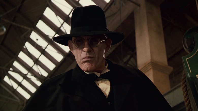 Judge Doom in hat and glasses