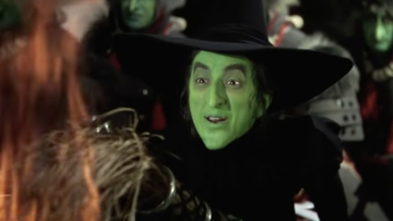 Wicked Witch holding flaming broom