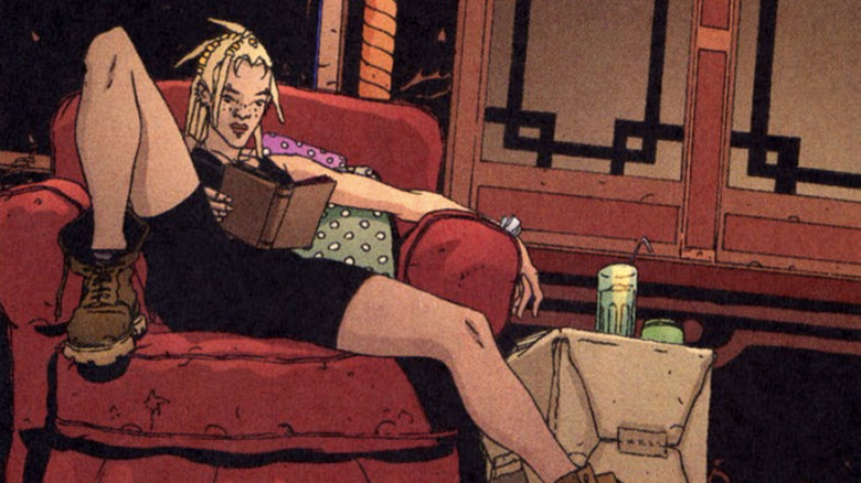 DMZ comics Zee Hernandez sitting in chair reading