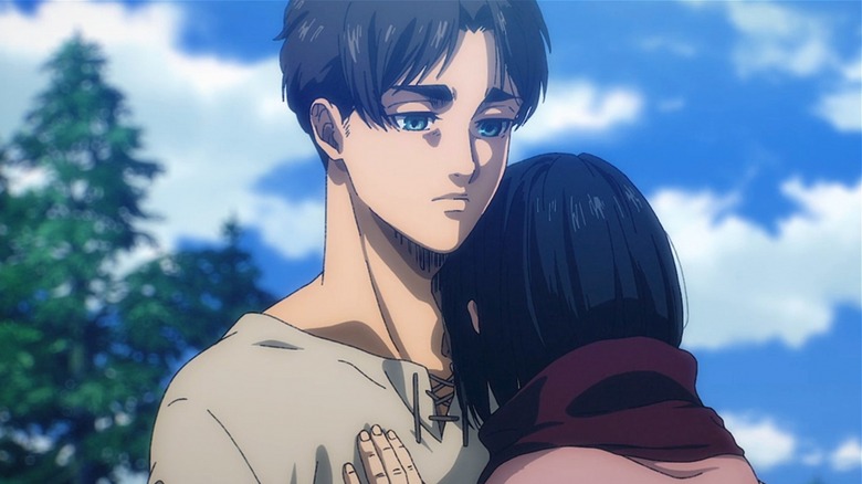 Eren holding Mikasa