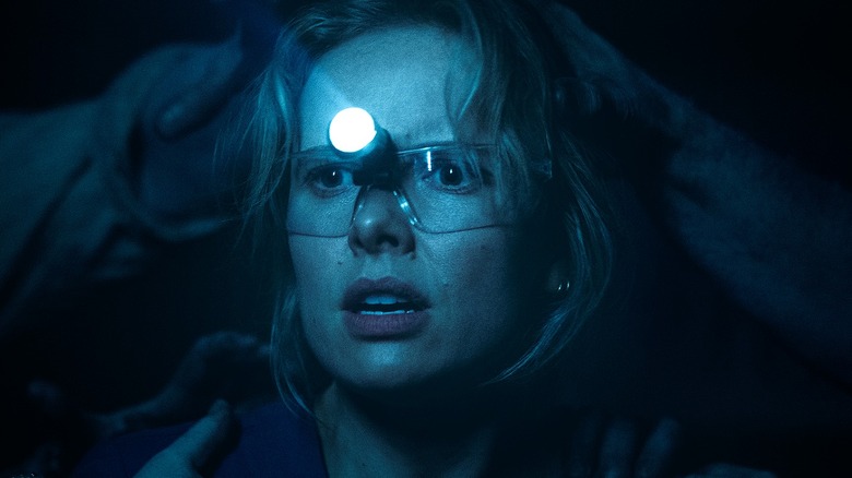 Creepy hands reaching for Gemma in Insidious: Out of the Further