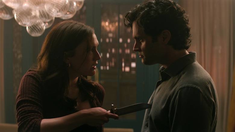 Kate holding a knife to Joe's chest