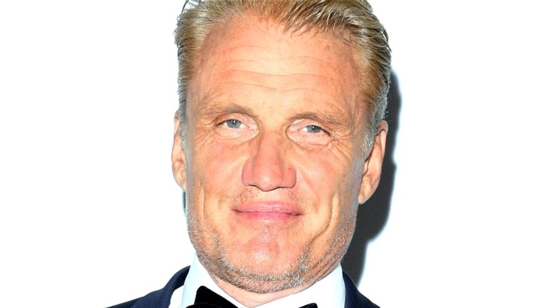 Dolph Lundgren smiling on red carpet