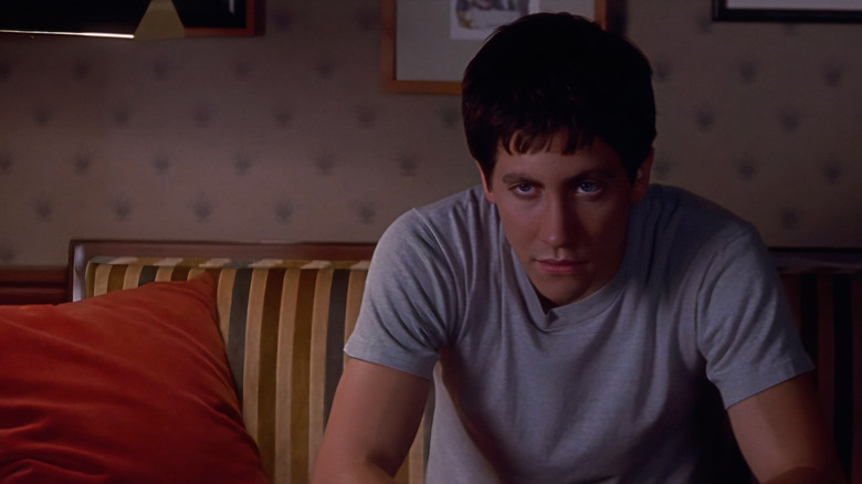 Donnie sits on a couch in "Donnie Darko" (2001)
