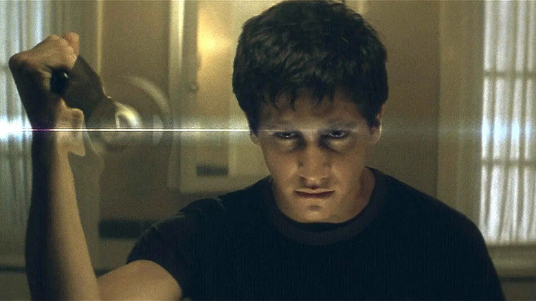 Donnie stabs a forcefield in "Donnie Darko" (2001)