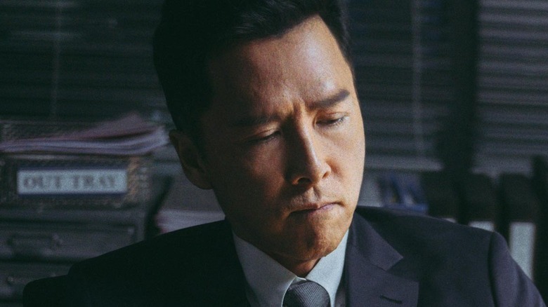 Donnie Yen looks down