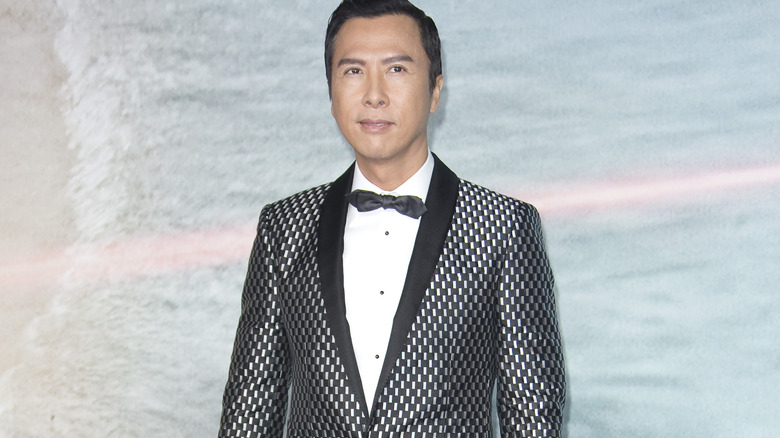 Yen in a checkered suit