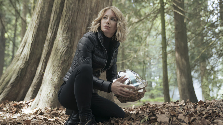 Harcourt examines the helmet