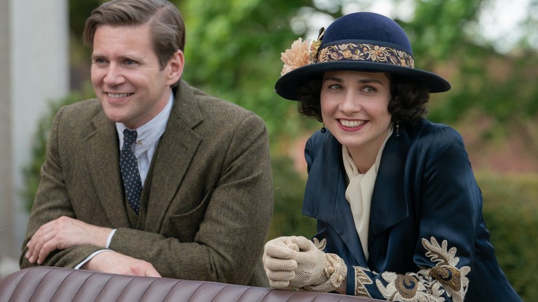 Allen and Myrna smiling and leaning together in "Downton Abbey: A New Era" (2022)
