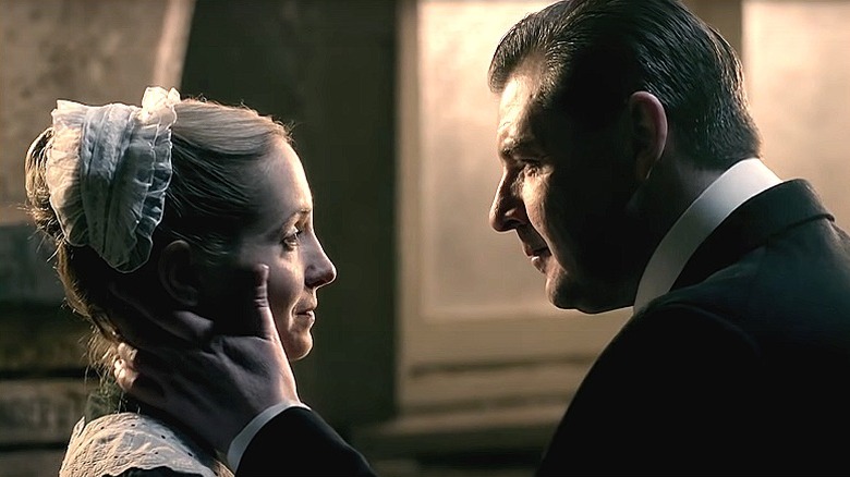 Mr. Bates touching Anna's face