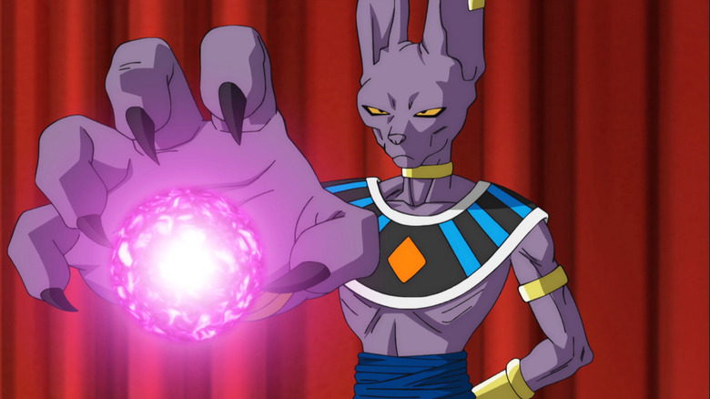 Beerus charges an energy blast