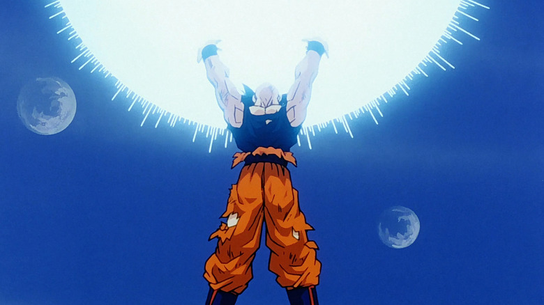 Goku holds up the spirit bomb
