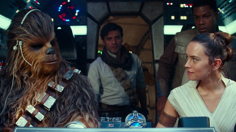 Chewbacca, Poe, Finn, and Rey on the Millennium Falcon