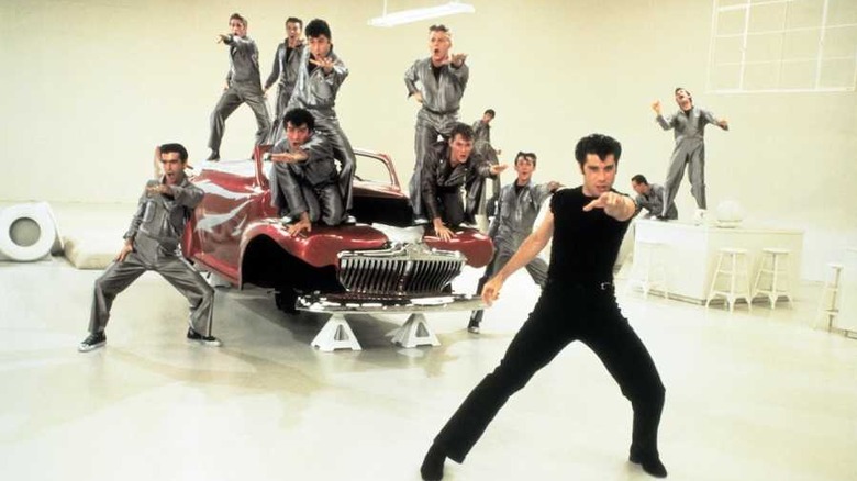 T-Birds dancing on red car