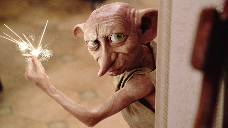 Dobby casting a spell in the Dursely family's kitchen